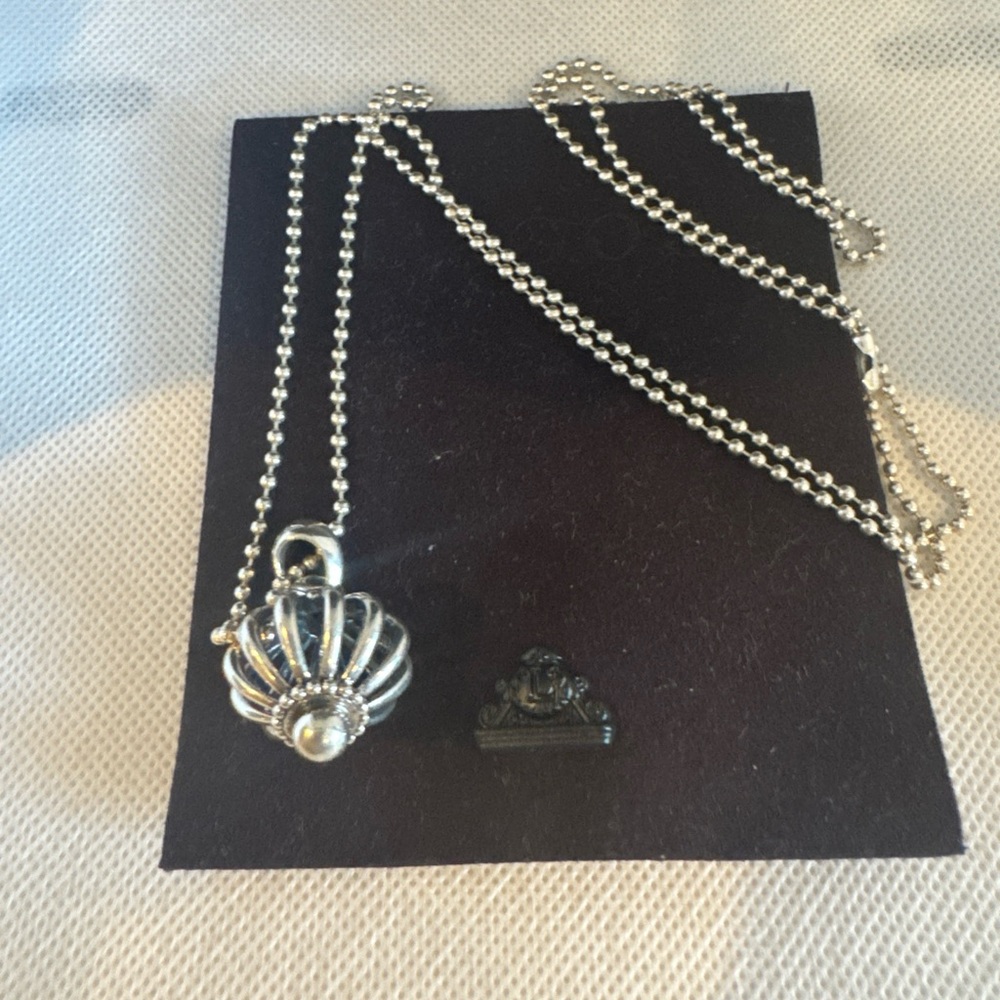 Lagos birdcage pendant with 16 inch chain